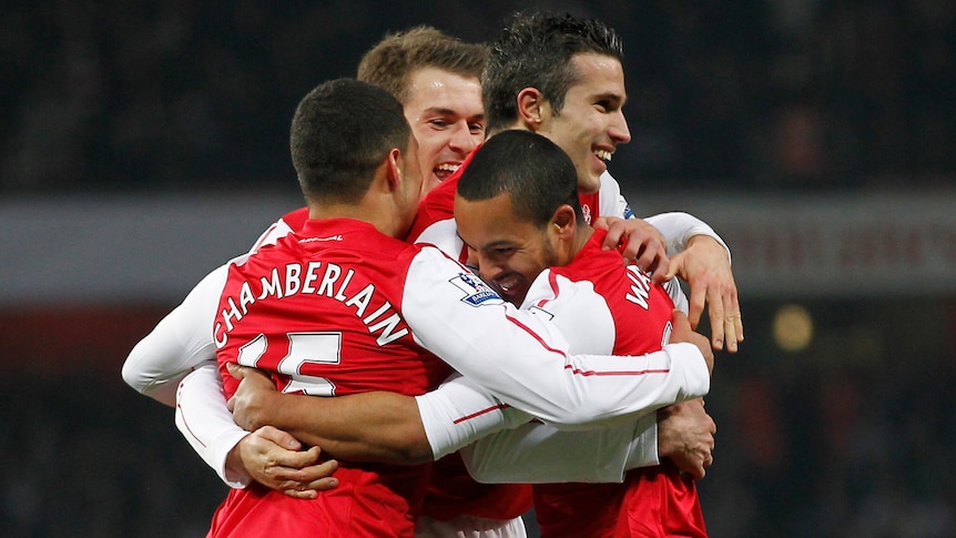 Fighting win ... Arsenal celebrates Theo Walcott's goal against Aston Villa (AFP Photo: Ian Kington)