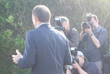 Tony Abbott is surrounded by photographers and cameramen as he speaks in his electorate of Warringah.