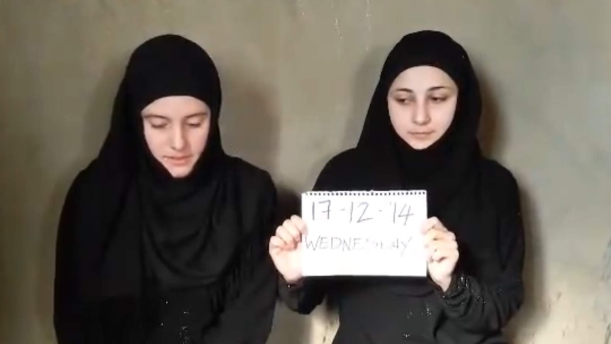 Italian aid workers wearing black dresses and headscarves in still of video posted to unofficial Islamic channel