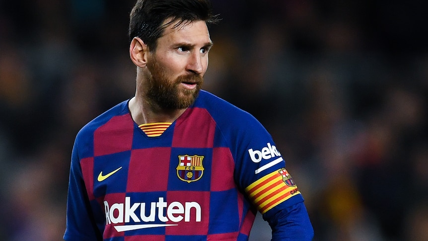 Lionel Messi looks to one side