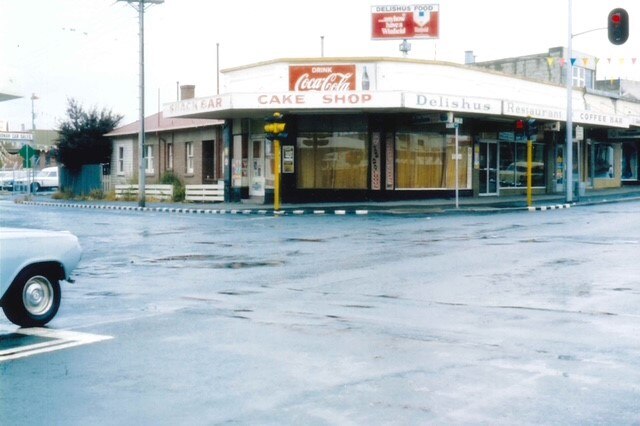 Shopfront on corner of street circa 1980s/1990s.