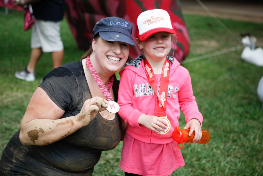 Kata Andric with her daughter after Miss Muddy run