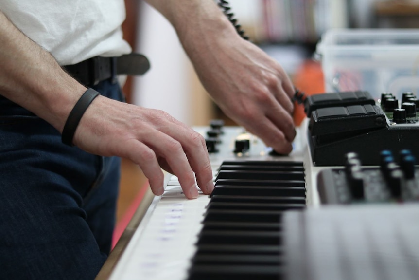 Man playing keyboard.