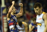 Marcus Bontempelli (L) celebrates the win by the Western Bulldogs over West Coast at Docklands.