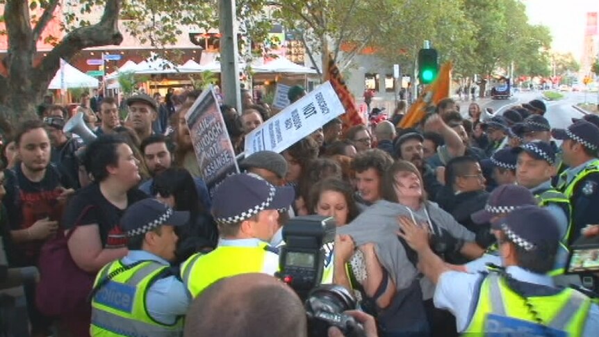 Angry and loud: the rowdy group protests on St Kilda Road.
