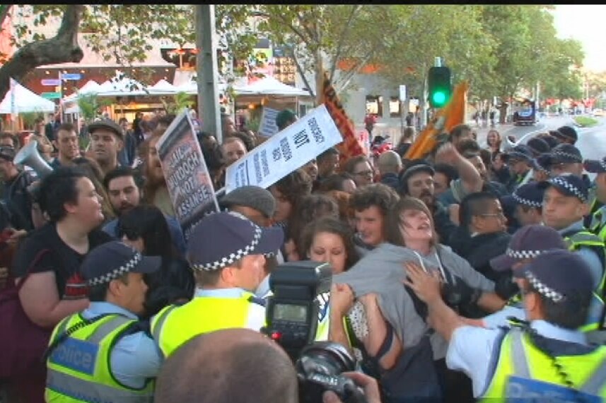 Angry and loud: the rowdy group protests on St Kilda Road.