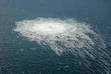 picture of bubbles on the surface of ocean waters 