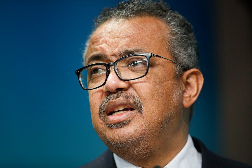 A close up of WHO director-general Tedros Adhanom Ghebreyesus with glasses