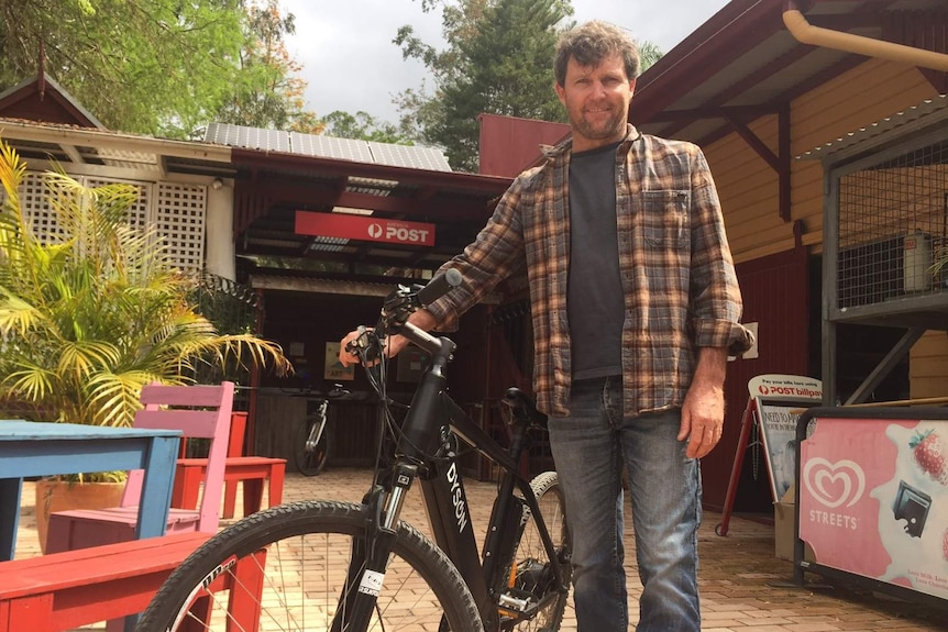 Tyalgum Energy Project leader Andrew Price with a solar-powered electric bike