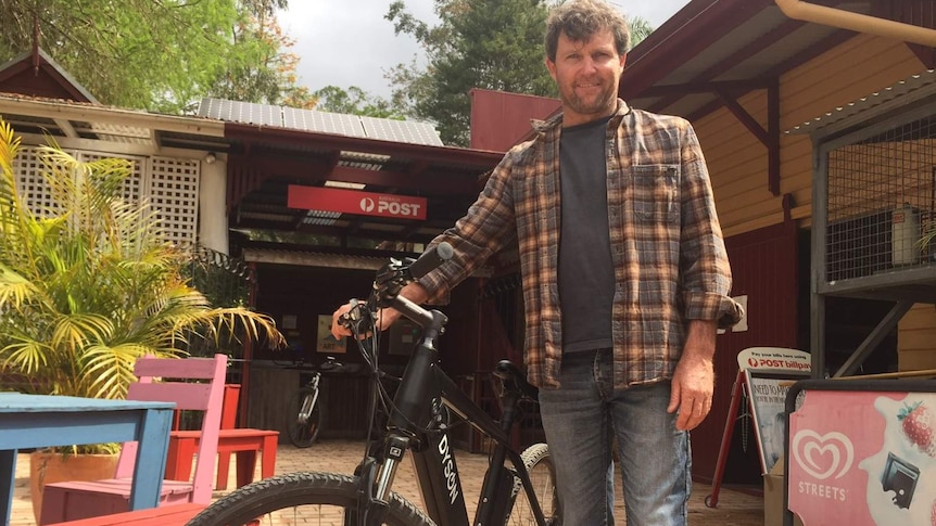Tyalgum Energy Project leader Andrew Price with a solar-powered electric bike