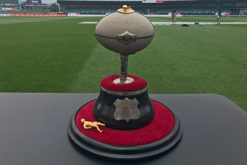 The Daily Telegraph Trophy featuring an emu egg and a broken gold figurine that once sat on top.