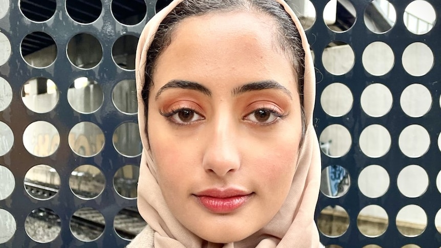 A head and shoulders photo of Anhar Al-Shameri looking at the camera and wearing her hijab.