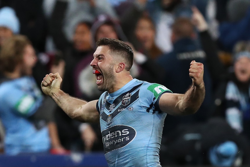 A man celebrates after a State of Origin try