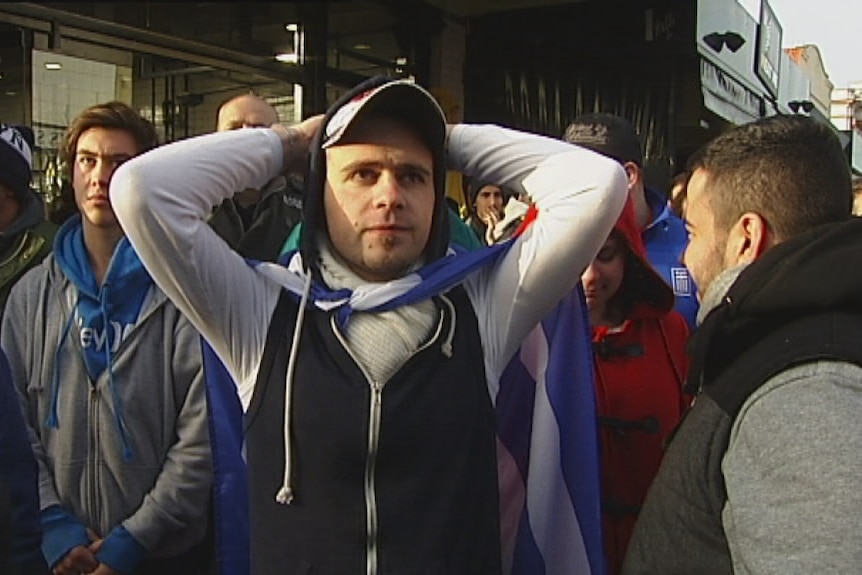 Melbourne show their disappointment after Greece is knocked out of the 2014 World Cup.