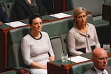 Emma Husar and Susan Lamb sit next to each other in parliament.