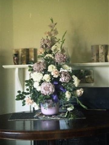 A 1970s-era photograph of a vase on a table.