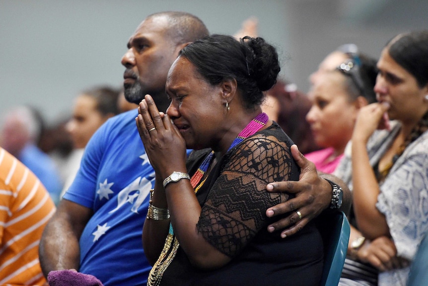 A woman cries during a memorial service for the children.
