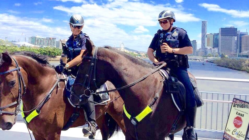 Police enjoy coffee on the Goodwill Bridge
