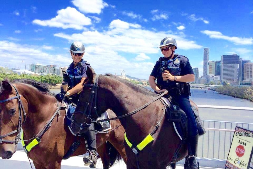 Police enjoy coffee on the Goodwill Bridge