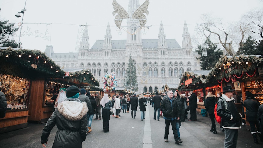 An aisle of stalls and people at Christmas markets in Vienna, the city that beat Melbourne as world's most liveable city in 2018