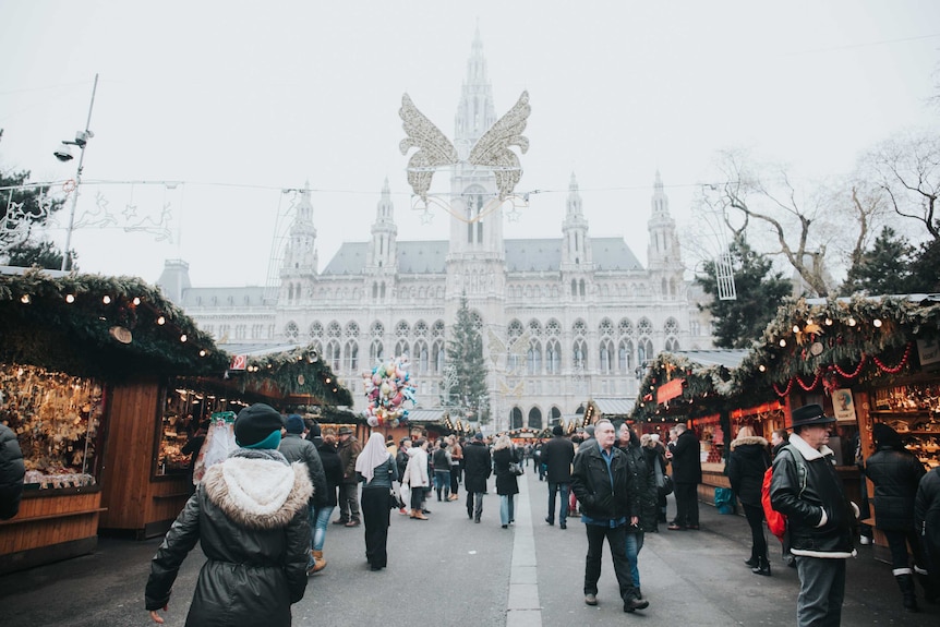 An aisle of stalls and people at Christmas markets in Vienna, the city that beat Melbourne as world's most liveable city in 2018