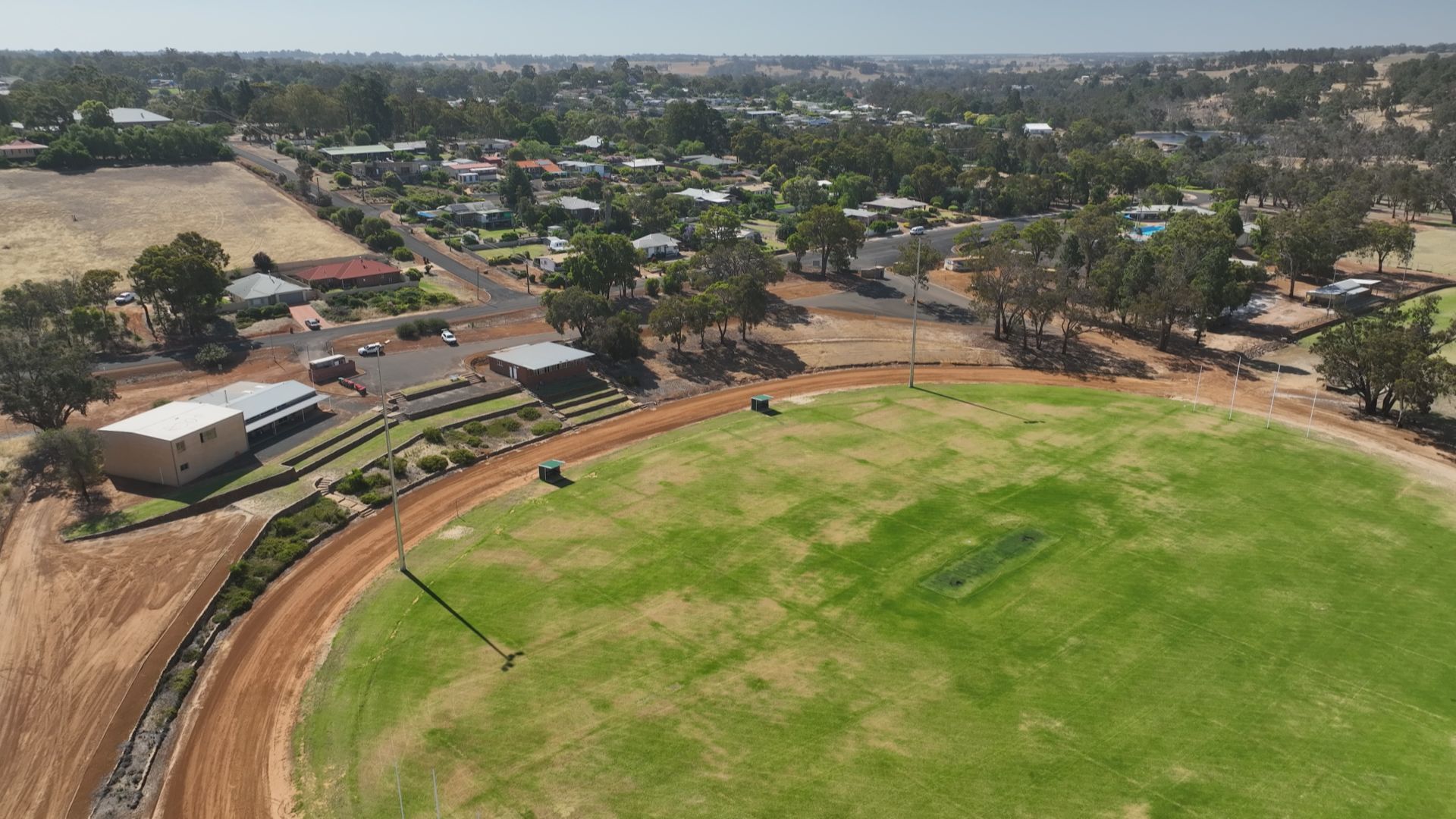 Drone shot of the sports fields in the town. 