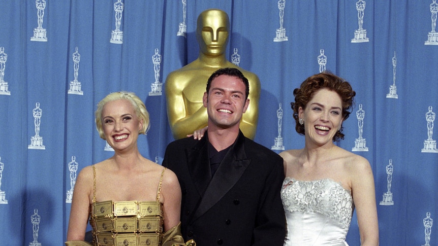Lizzy Gardiner and Tim Chappel accepting an Academy Award at the 1995 Oscars for their costume design in Priscilla.