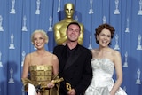 Lizzy Gardiner and Tim Chappel accepting an Academy Award at the 1995 Oscars for their costume design in Priscilla.