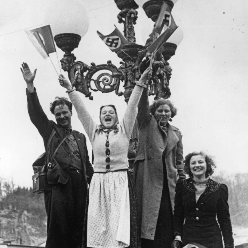 Austrian women wave swastikas in 1938