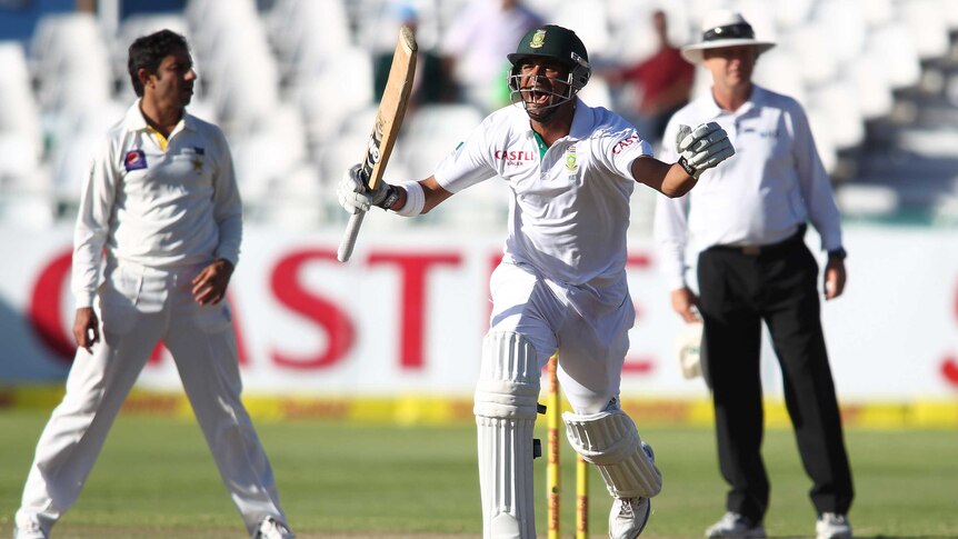 Man of the match ... Robin Peterson celebrates as South Africa wins the second Test.