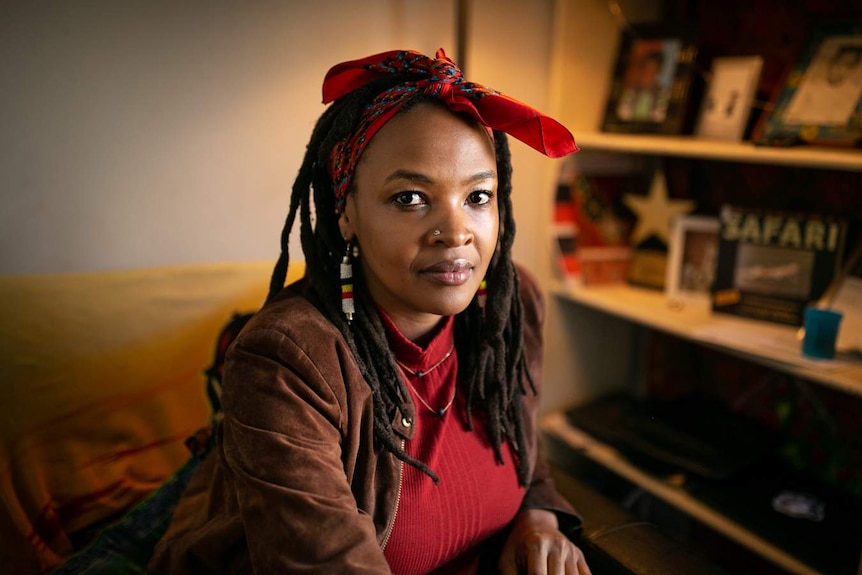 A woman with a red scarf in her hair