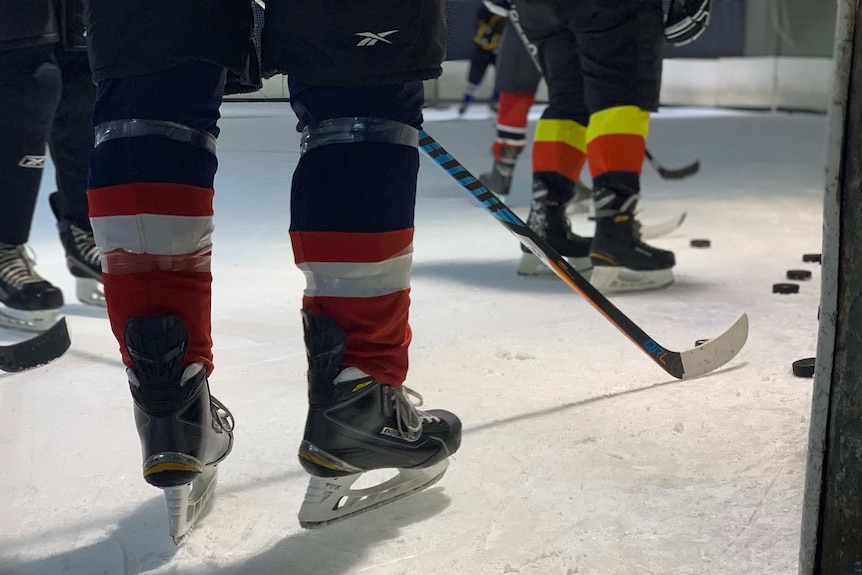 Skates worn by ice hockey players, as well as hockey sticks and pucks.