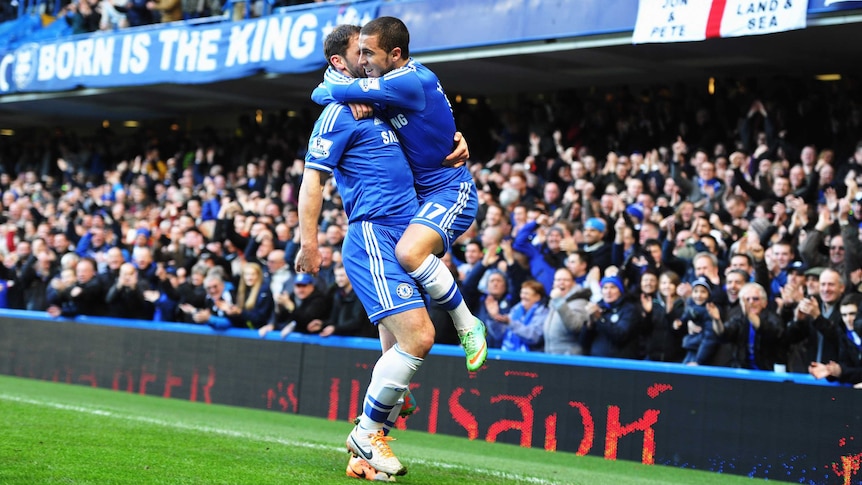 Chelsea's Eden Hazard (R) celebrates with Branislav Ivanovic in 3-0 win over Newcastle.