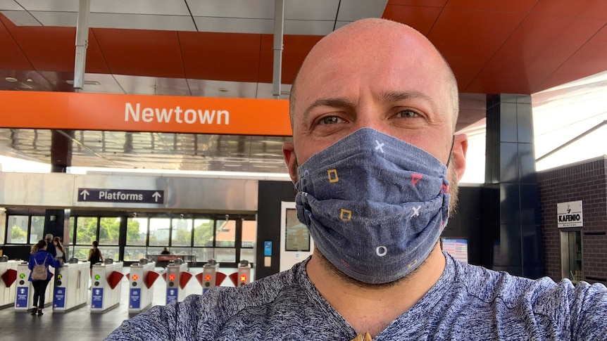 Tyson Shine wearing a mask at Newtown train station in Sydney.