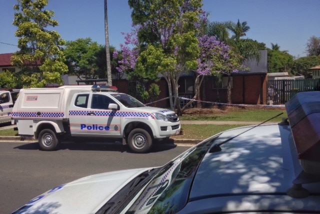 Police cars outside house where 19-year-old woman was allegedly held captive for three days at Waterford West, south of Brisbane