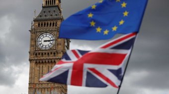 Big ben with EU and UK flags