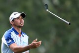 Jason Day throws up his club