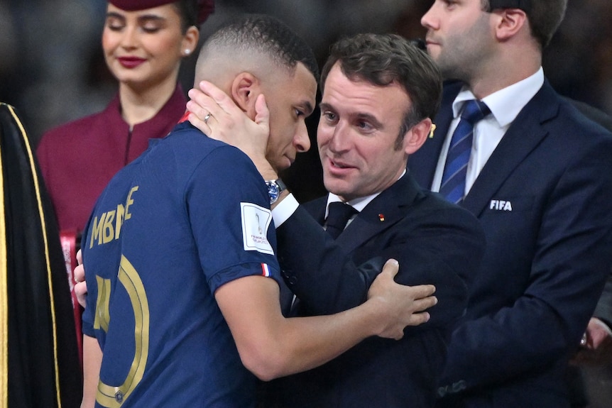 President Macron hugs Kylian Mbappe