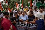 A group of protesters on the street in India. 