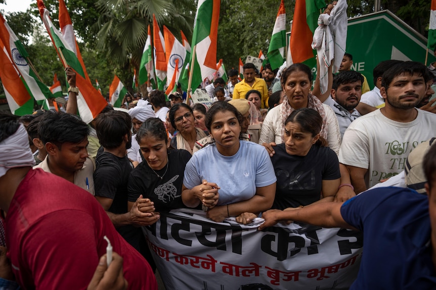 A group of protesters on the street in India. 