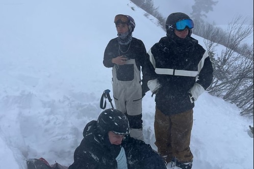 Photos of three skiiers in heavy snow 