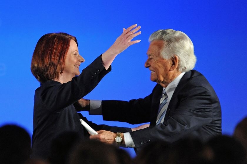 Prime Minister Julia Gillard hugs former prime minister Bob Hawke. (Dave Hunt: AAP)