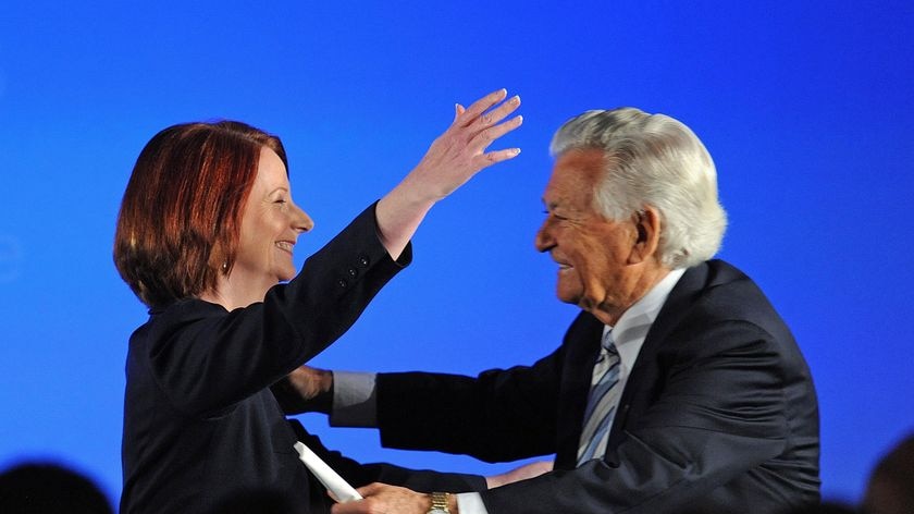 Prime Minister Julia Gillard hugs former prime minister Bob Hawke. (Dave Hunt: AAP)