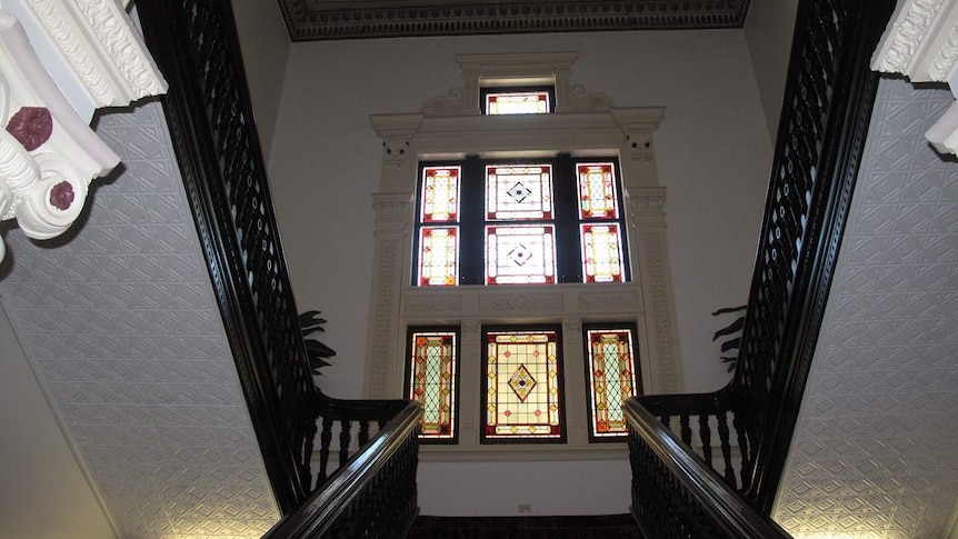 Stained glass windows, pressed tin ceiling and stairwell inside Kenmore House.