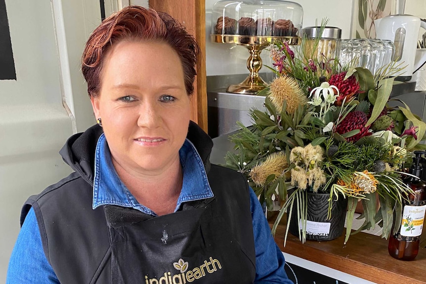 Sharon holds a tray of frozen quandongs.