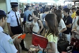 International passengers enter Bali's departure terminal
