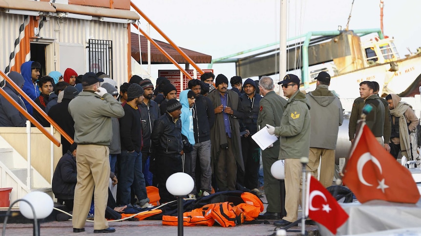 Refugees at a coast guard station in the Turkish coastal town of Dikili