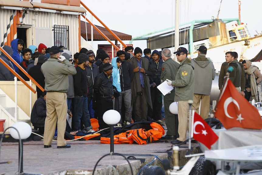 Refugees at a coast guard station in the Turkish coastal town of Dikili