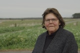 Indigenous woman Eileen Alberts stands in a field near her Victorian home.