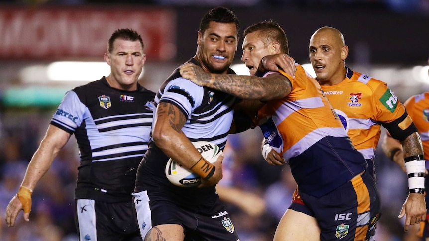 Fifita of the Sharks offloads